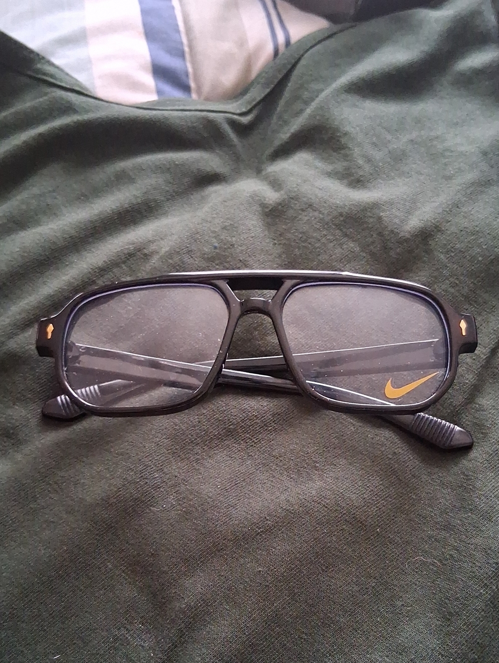 Nike Black Sunglasses with Gold Swoosh Detail